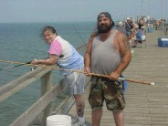 Some nice tourists, from Tennessee, fishing off the Kure pier. 